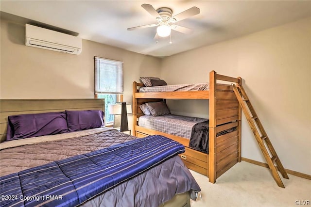 carpeted bedroom featuring ceiling fan and a wall mounted AC