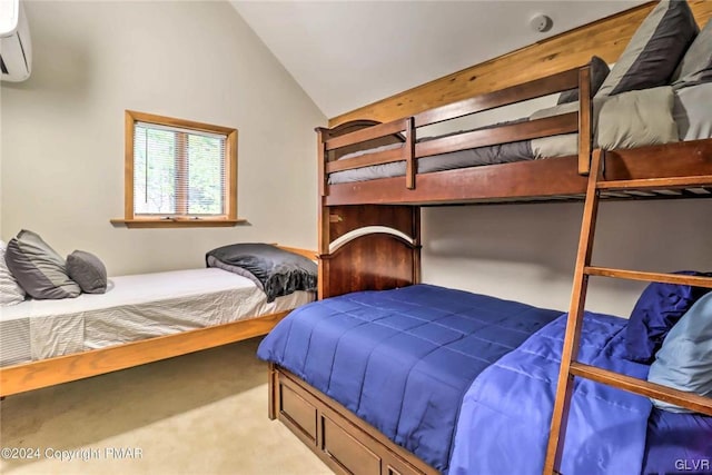 bedroom with an AC wall unit, lofted ceiling, and light colored carpet