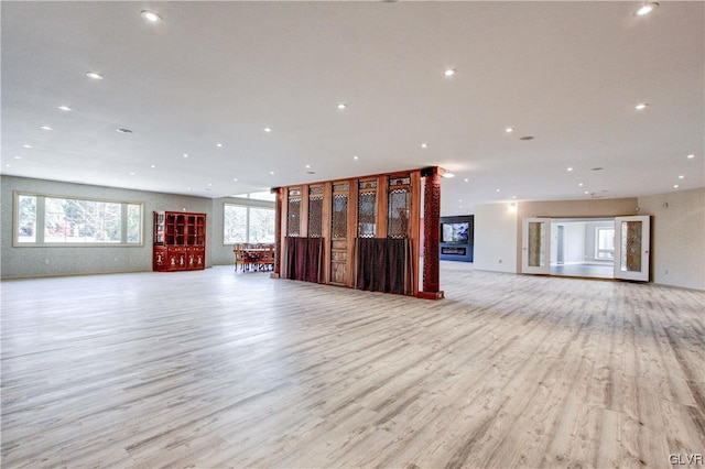 unfurnished living room featuring light hardwood / wood-style flooring