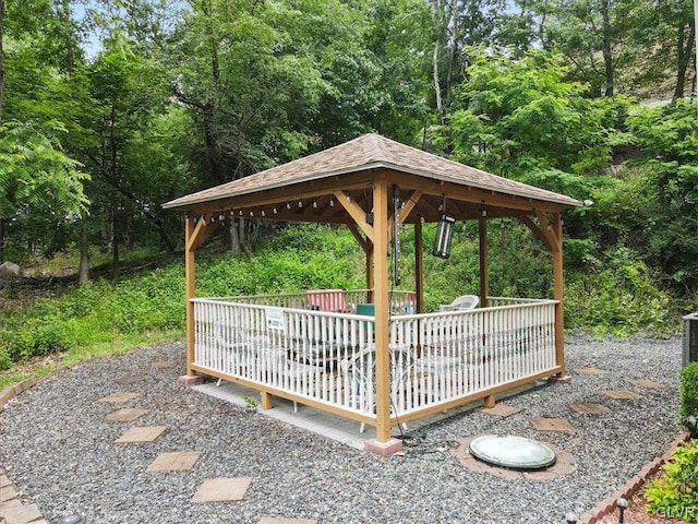 view of home's community with a gazebo and a wooden deck