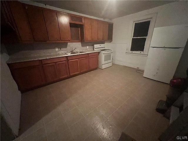 kitchen with sink and white appliances