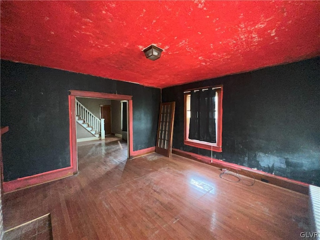 spare room with wood-type flooring