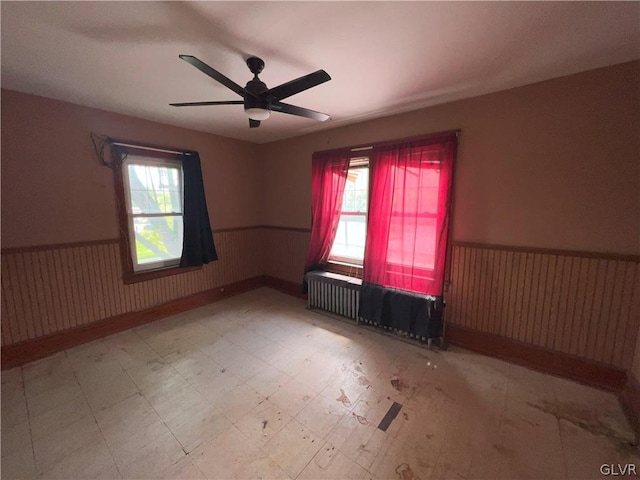 spare room with ceiling fan