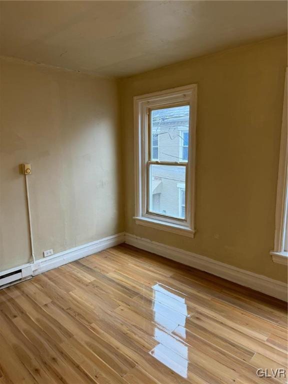 unfurnished room featuring light hardwood / wood-style floors