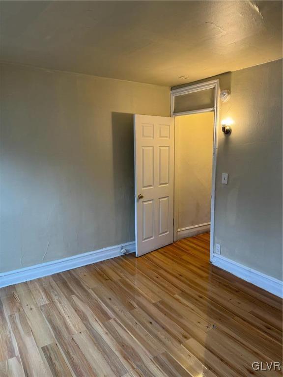 unfurnished room with light hardwood / wood-style flooring