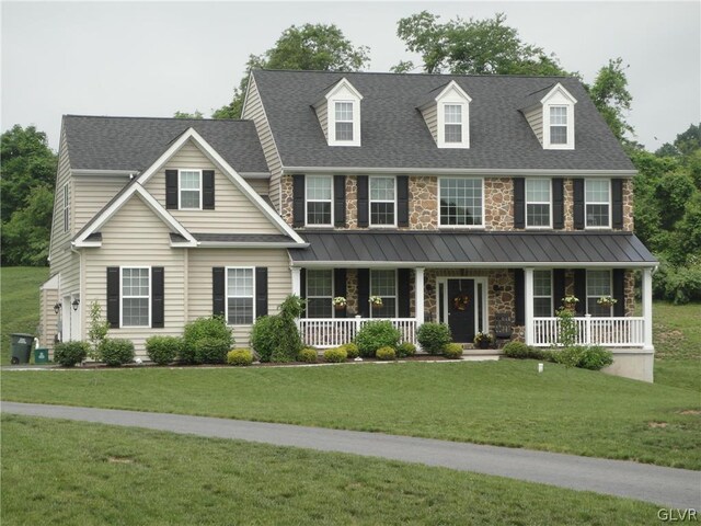 view of front of house featuring a porch and a front lawn