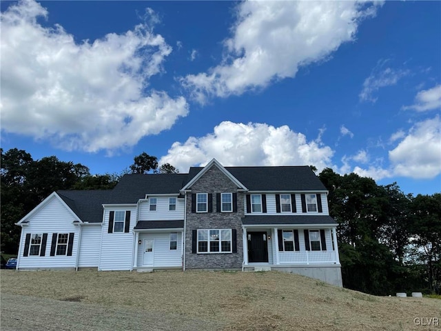 view of front of property featuring covered porch