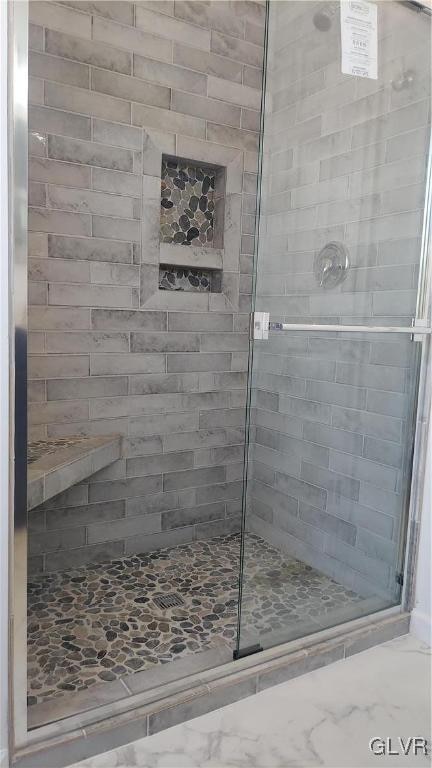 bathroom with an enclosed shower