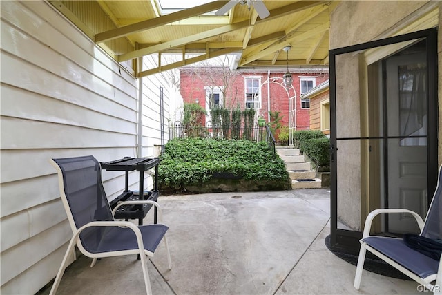 view of patio featuring ceiling fan