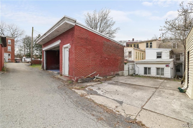 view of property exterior featuring brick siding