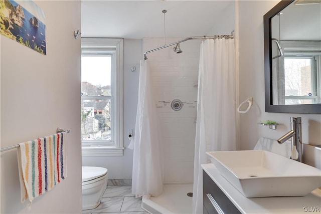 full bath featuring toilet, marble finish floor, plenty of natural light, and a stall shower