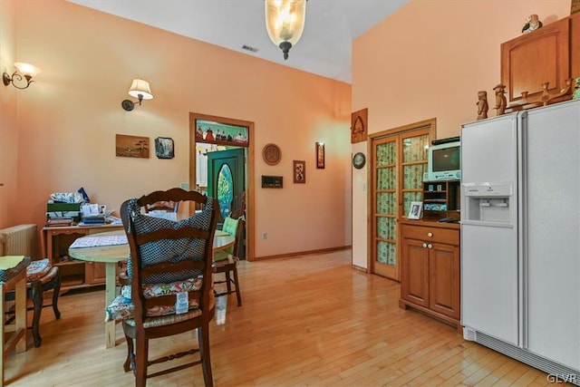 dining area with light hardwood / wood-style floors