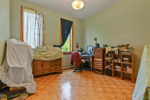 office area featuring baseboard heating and light parquet flooring