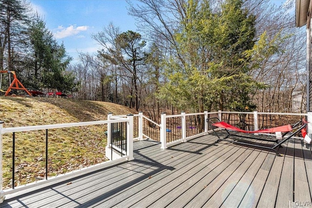 wooden terrace with a playground