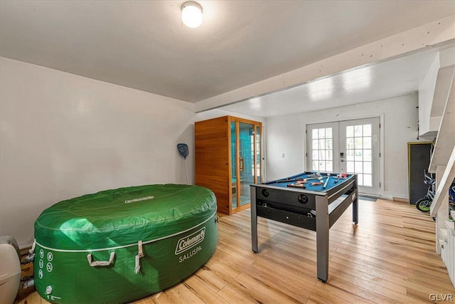 rec room featuring billiards, french doors, and light hardwood / wood-style flooring