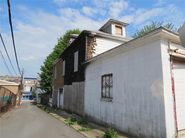 view of property exterior with a garage