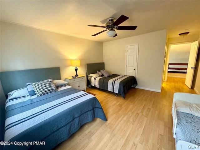 bedroom featuring ceiling fan and light hardwood / wood-style flooring