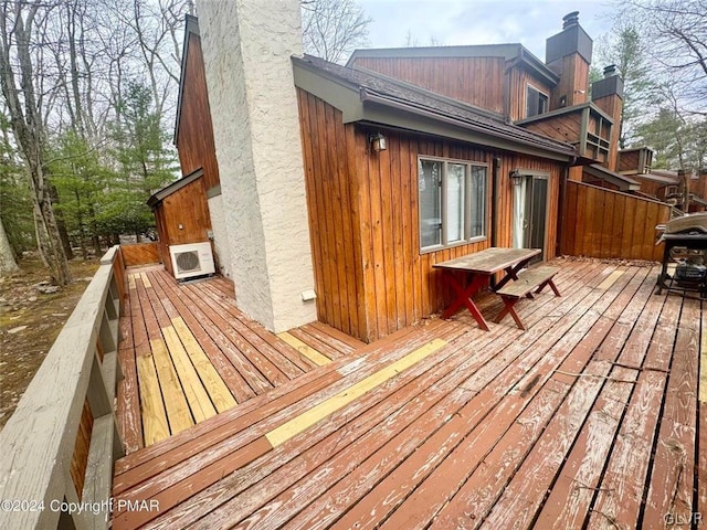 wooden terrace featuring grilling area