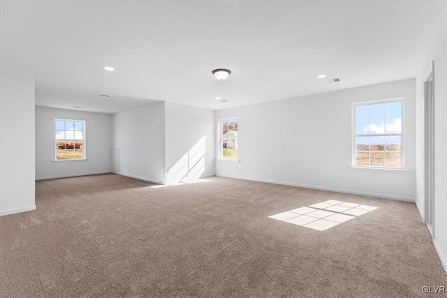 spare room with light colored carpet