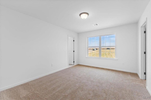 spare room featuring carpet flooring