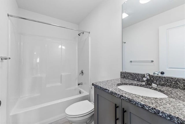 full bathroom with toilet, vanity, and shower / bathtub combination