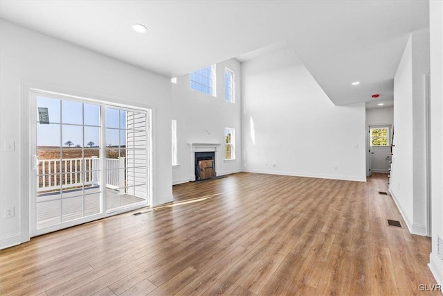 unfurnished living room with light wood-type flooring