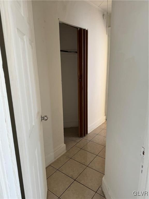 hallway featuring light tile patterned flooring