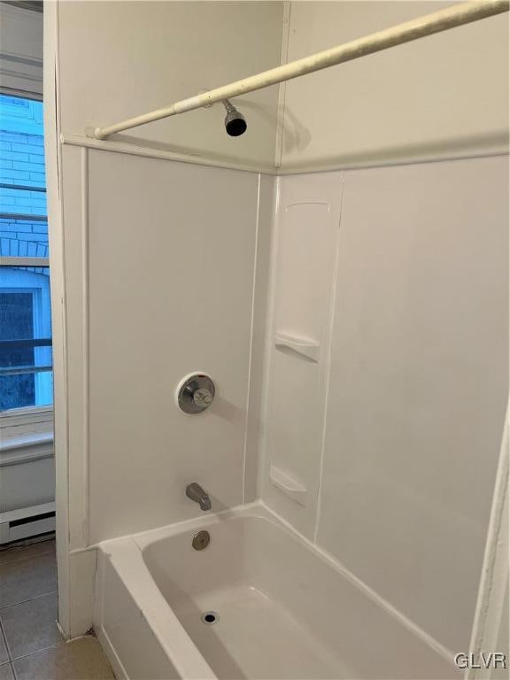 bathroom featuring shower / tub combination and tile patterned flooring