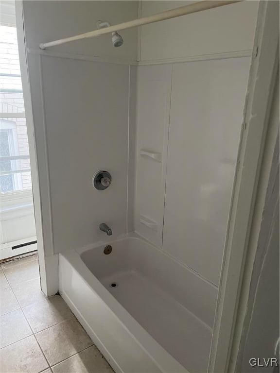 bathroom featuring tub / shower combination, a baseboard radiator, and tile patterned floors