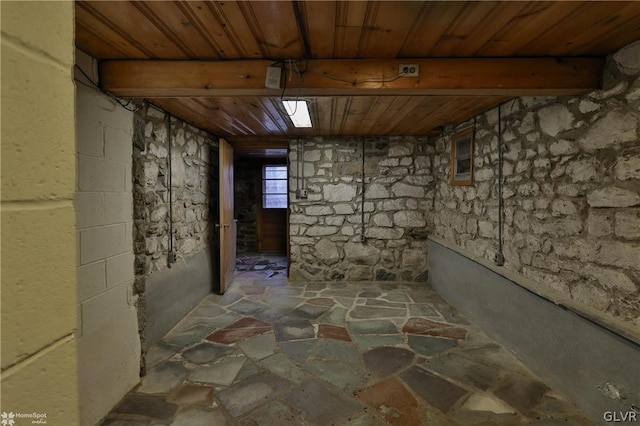 basement featuring wooden ceiling