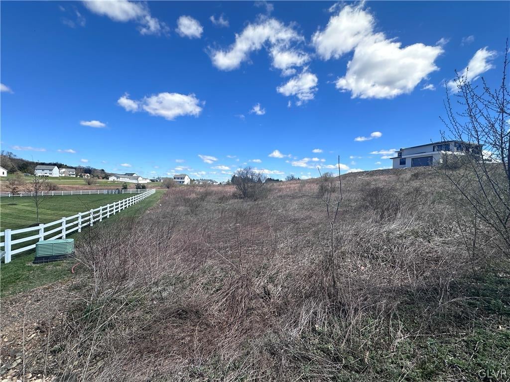 exterior space with a rural view