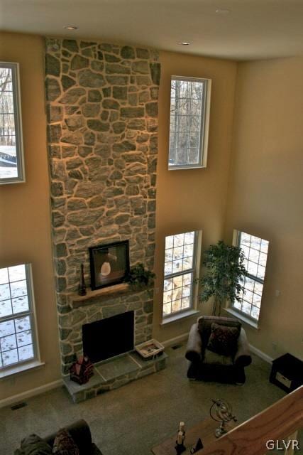 2059 Sunrise Dr Lot 7, Springfield Twp, PA 18036 - living room featuring a stone fireplace, carpet flooring, and baseboards