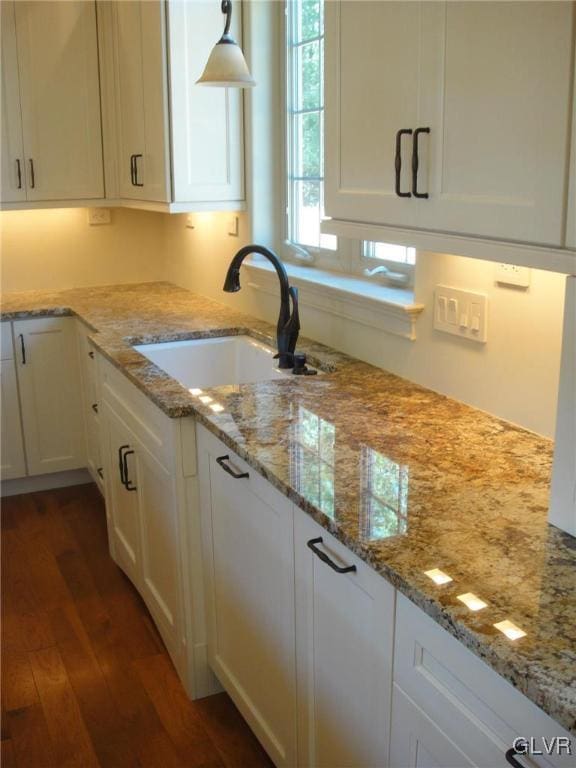 2059 Sunrise Dr Lot 7, Springfield Twp, PA 18036 - kitchen featuring a sink, wood finished floors, white cabinetry, and light stone countertops