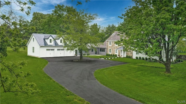 view of front of home featuring a garage and a front lawn