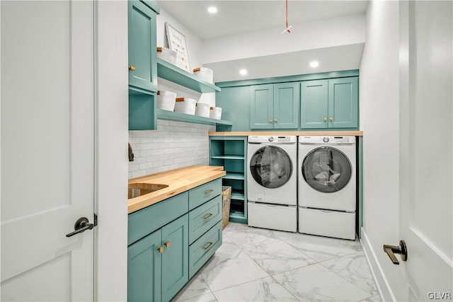 laundry room with cabinets and independent washer and dryer