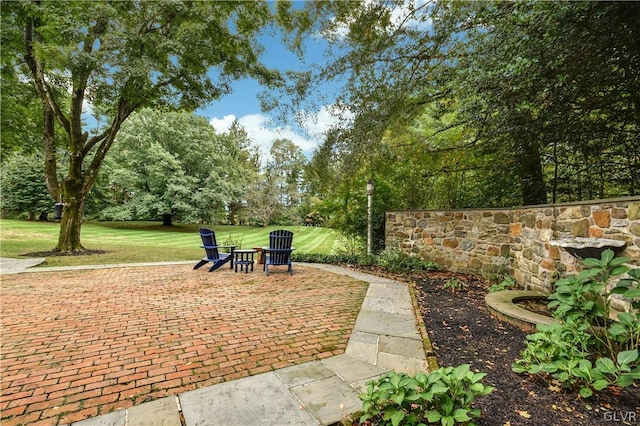 exterior space featuring a yard and a patio area