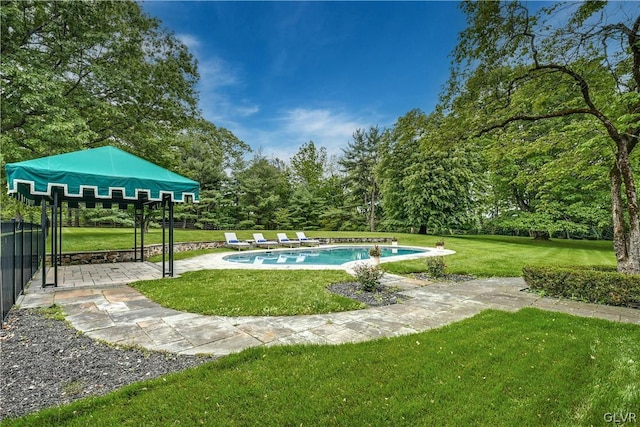 view of property's community featuring a yard, a gazebo, and a pool