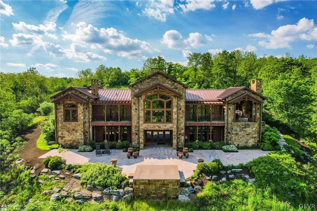 back of property featuring a patio area