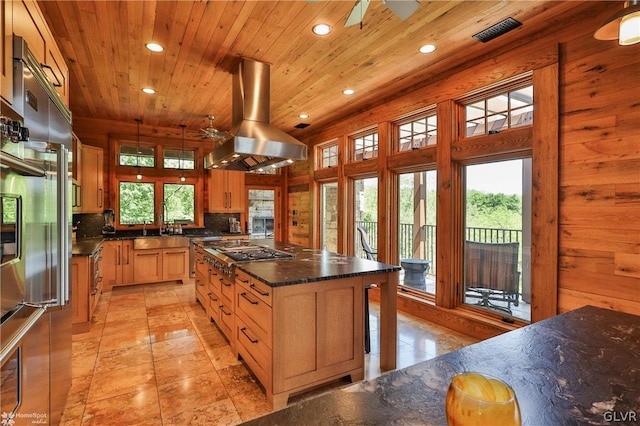 kitchen featuring ceiling fan, wood ceiling, island exhaust hood, and decorative backsplash