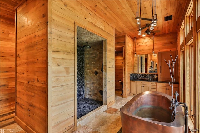 bathroom featuring vanity, tile patterned floors, plus walk in shower, wooden walls, and wood ceiling