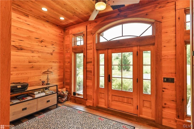 foyer entrance with ceiling fan and hardwood / wood-style floors