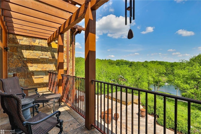 balcony featuring a water view