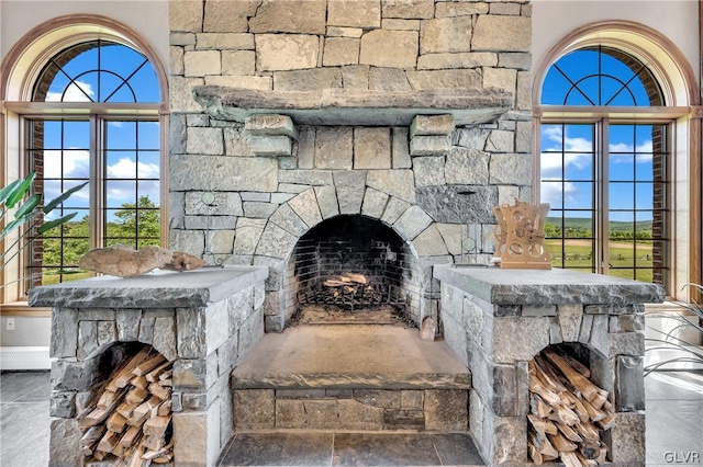 interior details with an outdoor stone fireplace