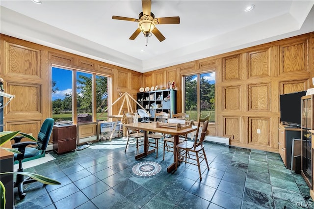 dining space featuring stone finish flooring, a ceiling fan, and recessed lighting