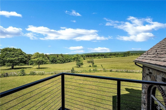 balcony featuring a rural view