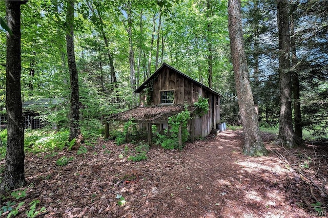 exterior space featuring a wooded view