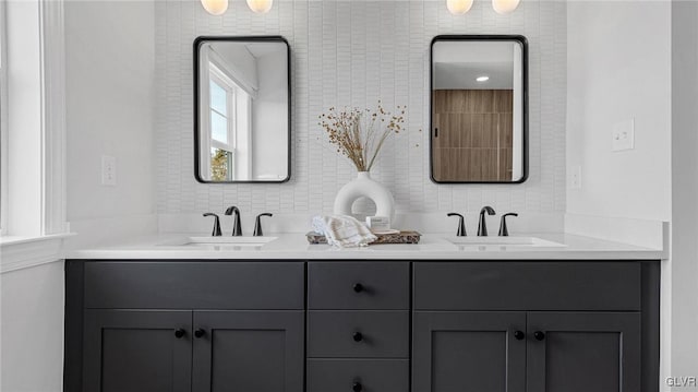 bathroom featuring vanity and backsplash