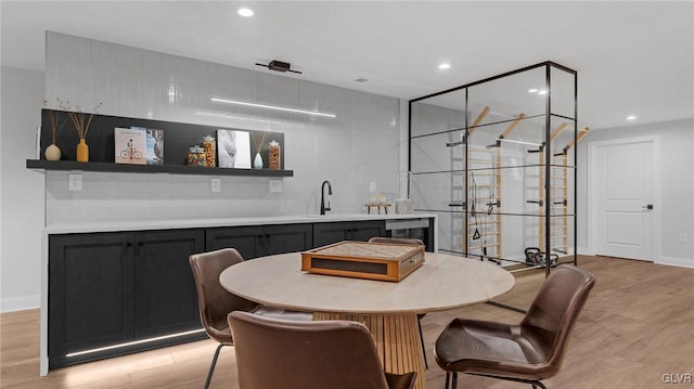 interior space with sink and light wood-type flooring