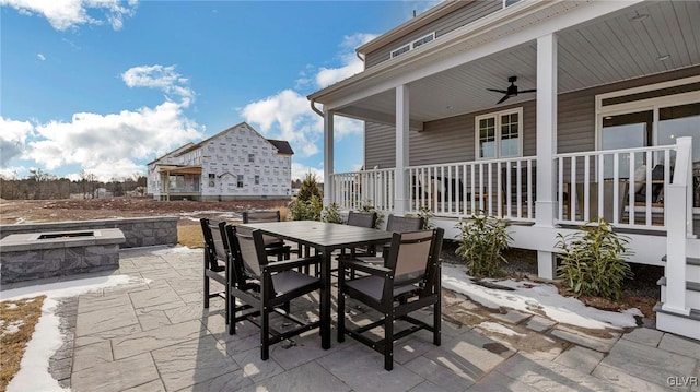 view of patio featuring an outdoor fire pit and ceiling fan