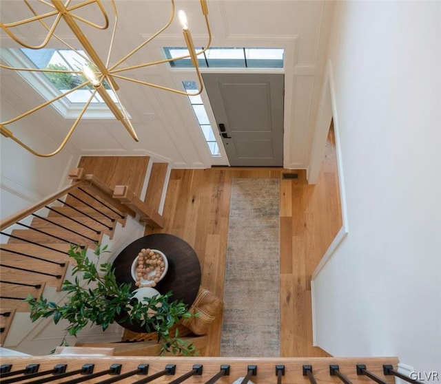 foyer with wood-type flooring and plenty of natural light